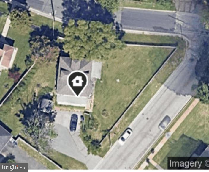 a aerial view of a house with a yard