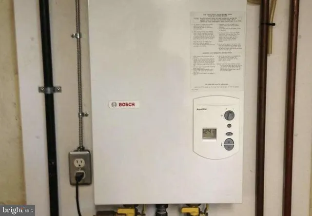 a kitchen with stainless steel appliances granite countertop a refrigerator and a stove