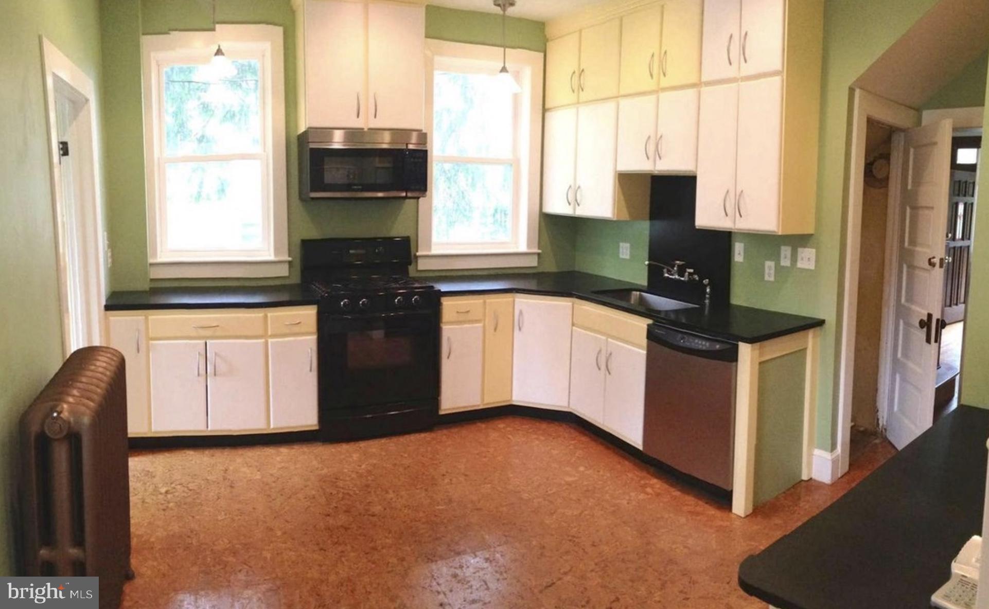 5001 Overton Street Baltimore, MD 21229 - Photo 15 of 21 a kitchen with stainless steel appliances granite countertop a refrigerator and a stove