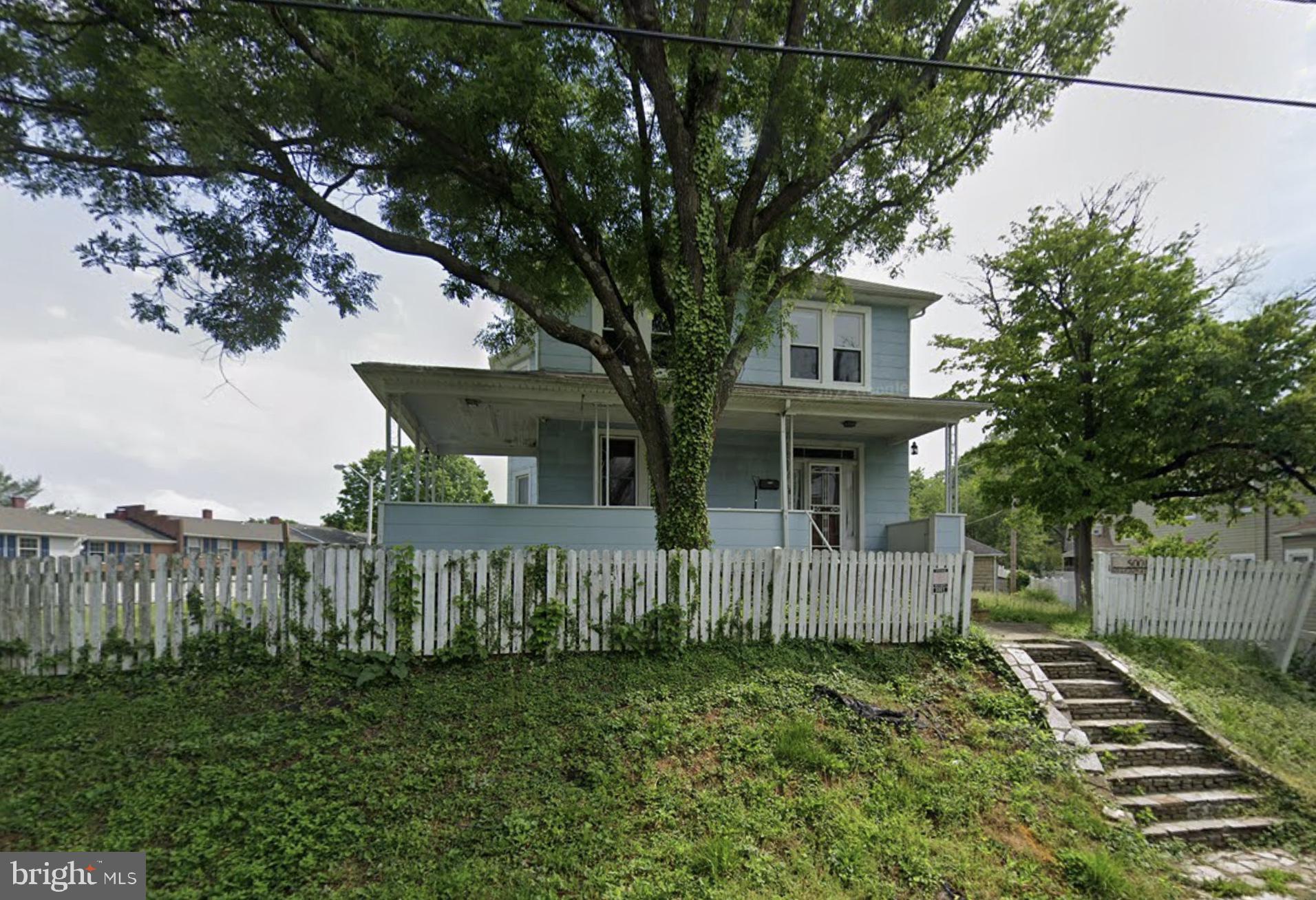 5001 Overton Street Baltimore, MD 21229 - Photo 2 of 21 a front view of a house with a yard