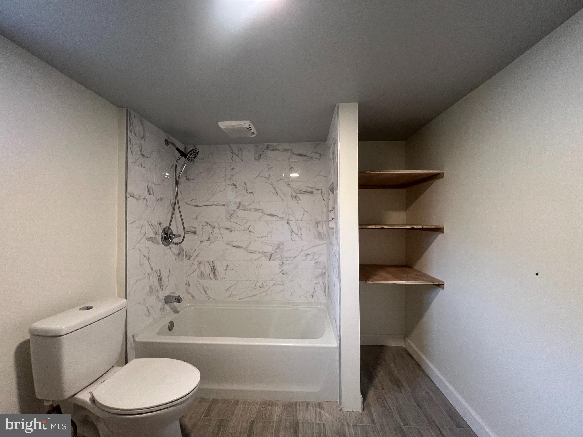 5001 Overton Street Baltimore, MD 21229 - Photo 30 of 32 a bathroom with a toilet and a shower