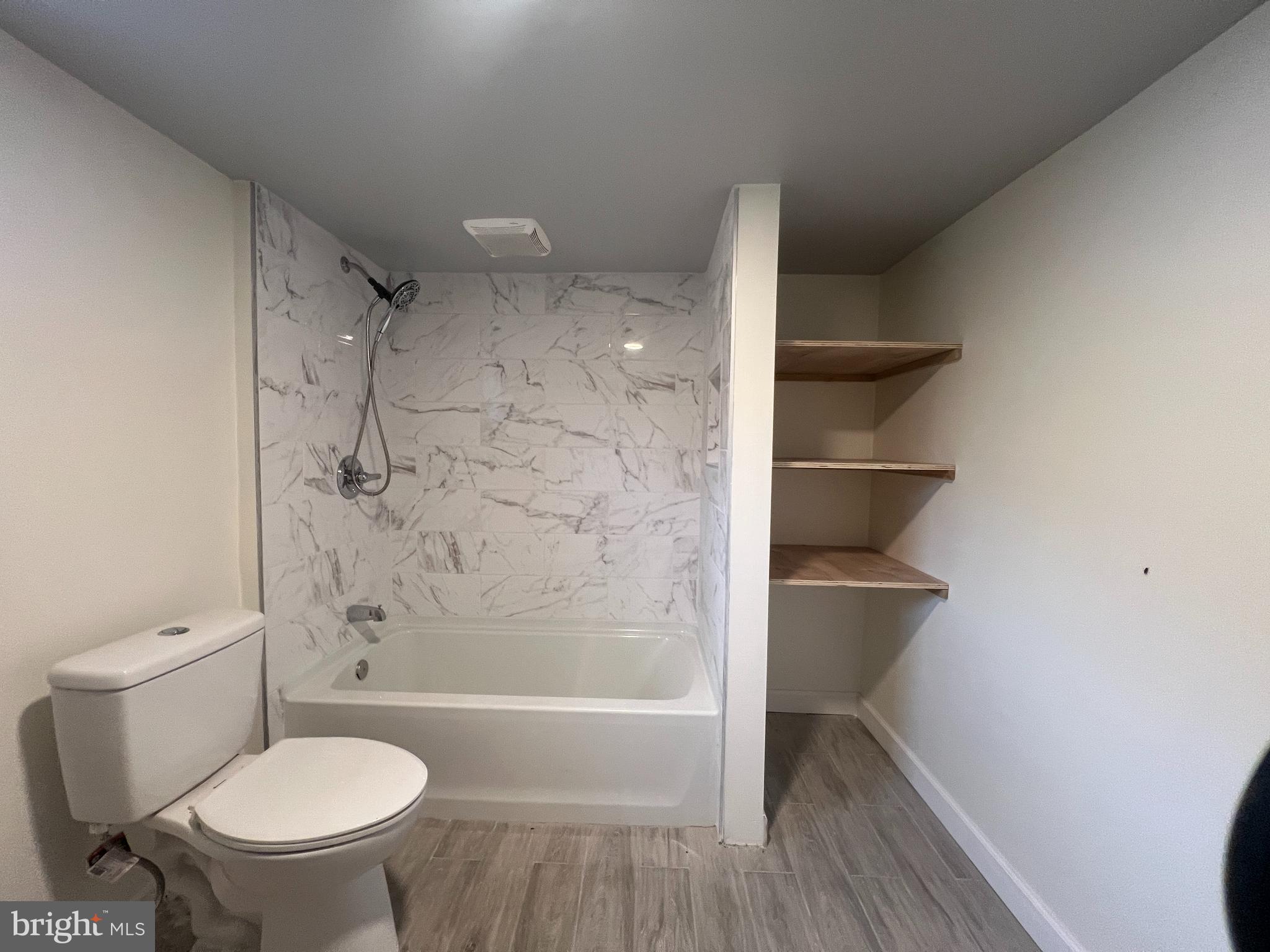 5001 Overton Street Baltimore, MD 21229 - Photo 31 of 32 a bathroom with a toilet and a shower