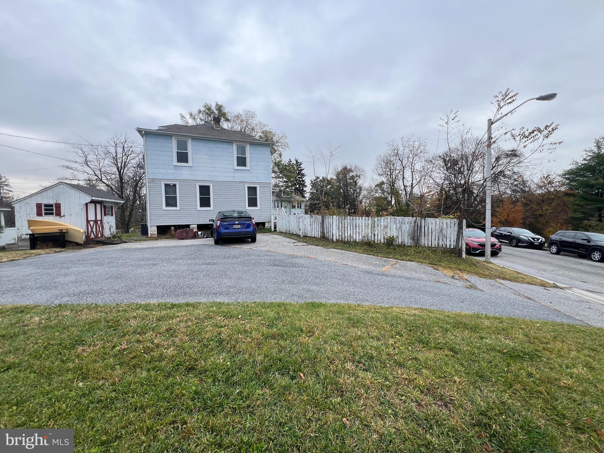 5001 Overton Street Baltimore, MD 21229 - Photo 7 of 21 a view of street with parked cars