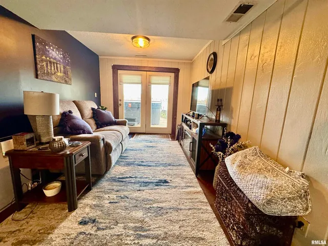 a bed room with a bed and a mirror