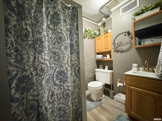 a bathroom with a toilet and a sink