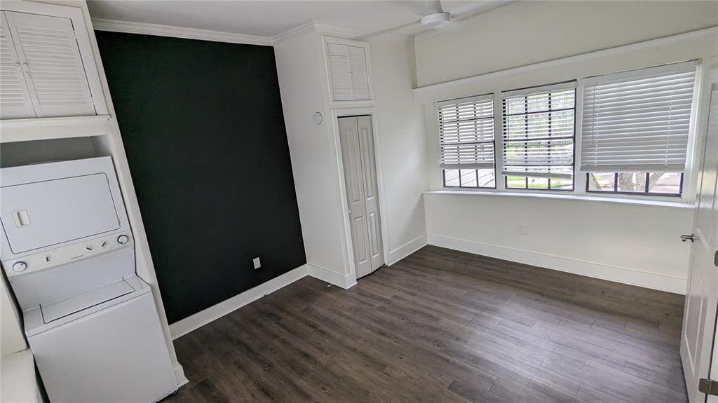 1020 South Rome Avenue, Unit 1/2 Tampa, FL 33606 - Photo 5 of 8 wooden floor in an empty room with a window