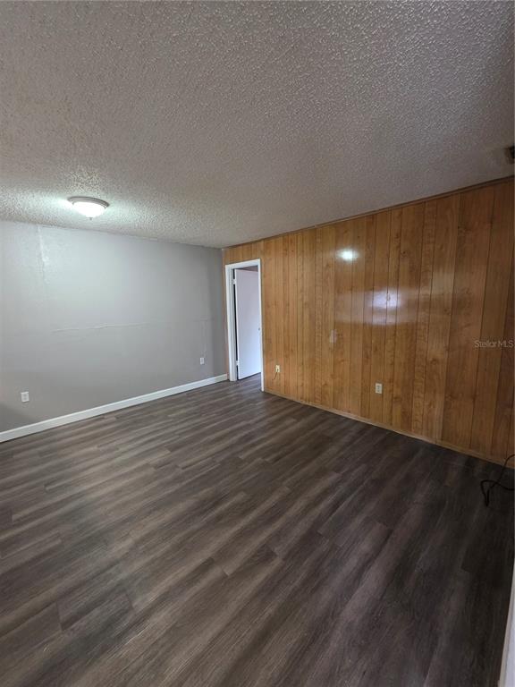 2811 Southwest Archer Road, Unit R142 Gainesville, FL 32608 - Photo 11 of 30 a view of an empty room with wooden floor