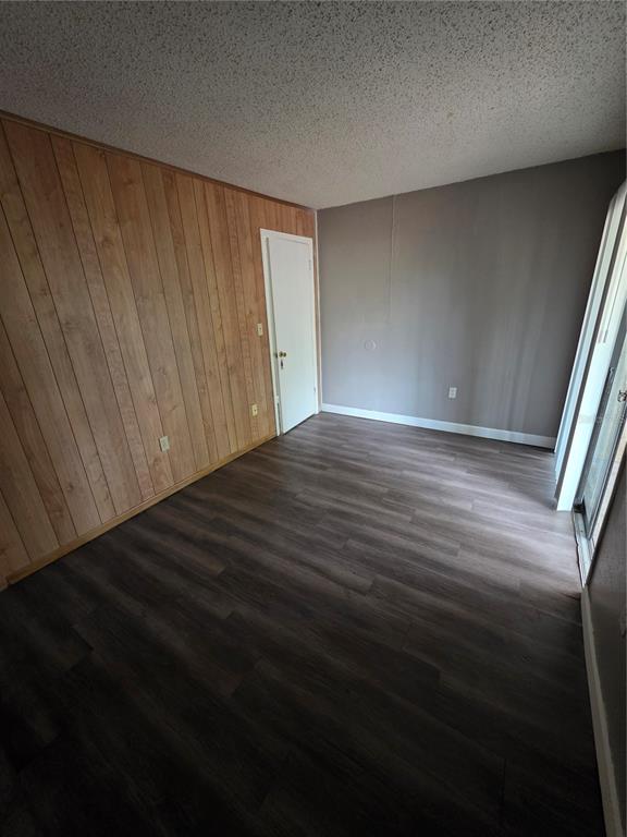 2811 Southwest Archer Road, Unit R142 Gainesville, FL 32608 - Photo 18 of 30 a view of an empty room with wooden floor