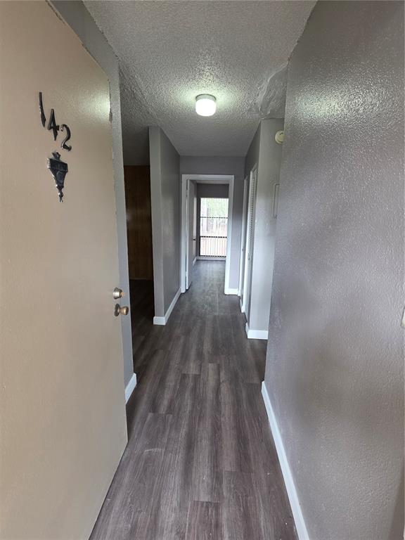 2811 Southwest Archer Road, Unit R142 Gainesville, FL 32608 - Photo 2 of 30 a view of a hallway with wooden floor