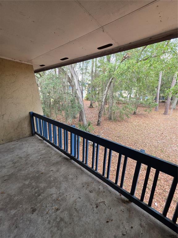 2811 Southwest Archer Road, Unit R142 Gainesville, FL 32608 - Photo 21 of 30 a view of a porch with a wooden floor