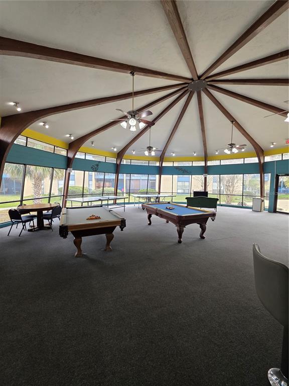 2811 Southwest Archer Road, Unit R142 Gainesville, FL 32608 - Photo 23 of 30 a sitting area with pool table and chairs