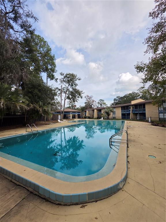 2811 Southwest Archer Road, Unit R142 Gainesville, FL 32608 - Photo 30 of 30 a view of a house with a yard