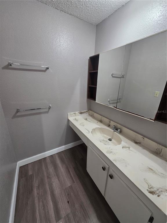 2811 Southwest Archer Road, Unit R142 Gainesville, FL 32608 - Photo 5 of 30 a bathroom with a sink and a mirror