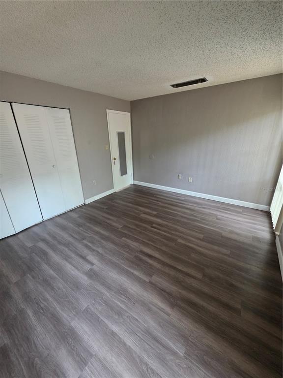 2811 Southwest Archer Road, Unit R142 Gainesville, FL 32608 - Photo 9 of 30 a view of empty room with wooden floor