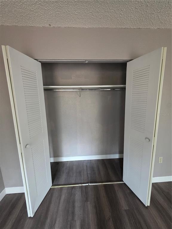 2811 Southwest Archer Road, Unit R142 Gainesville, FL 32608 - Photo 10 of 30 a view of closet area with wooden floor
