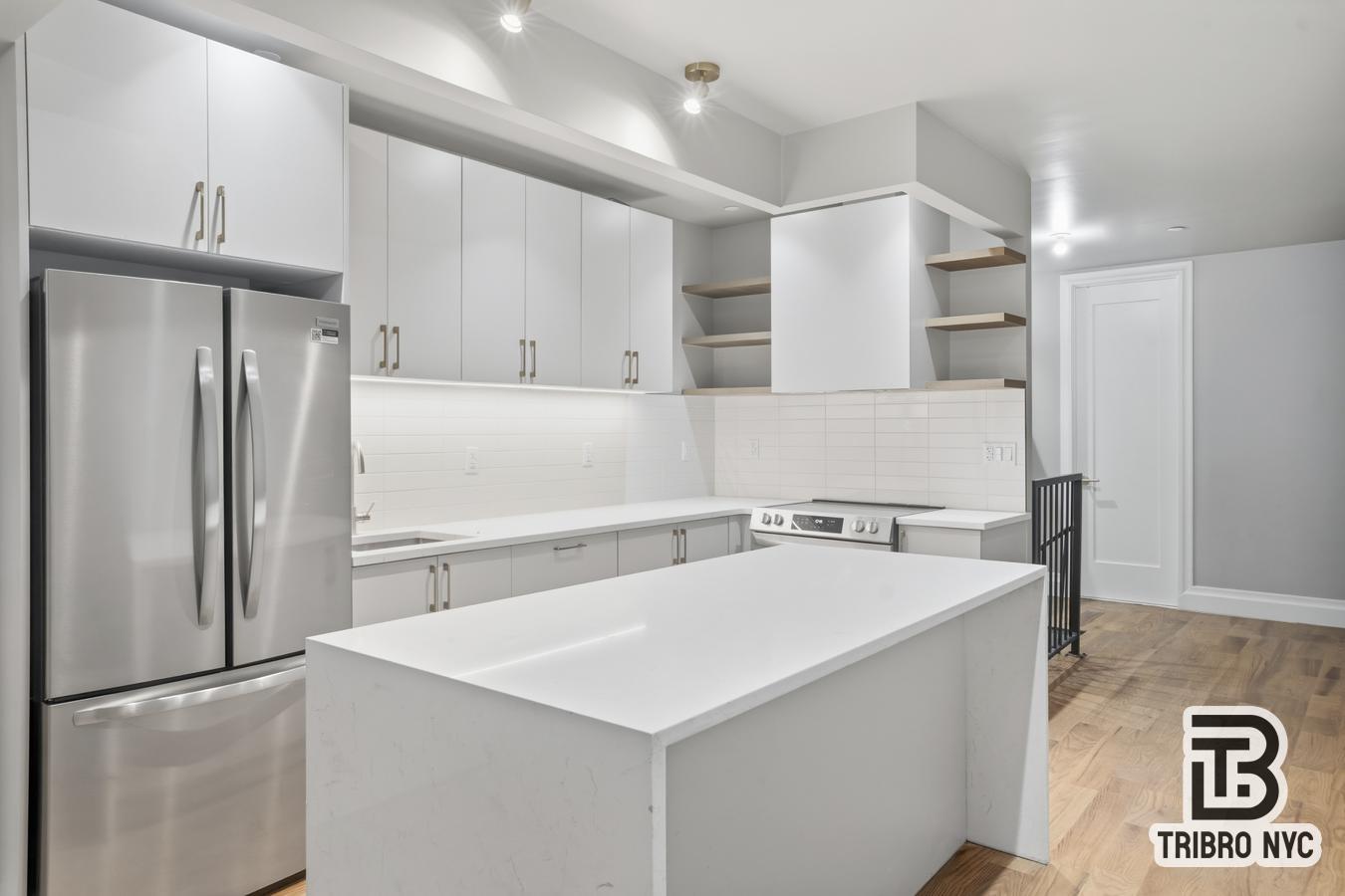 129 Russell Street, Unit 1E Brooklyn, NY 11222 - Photo 3 of 8 a kitchen with a refrigerator and a sink
