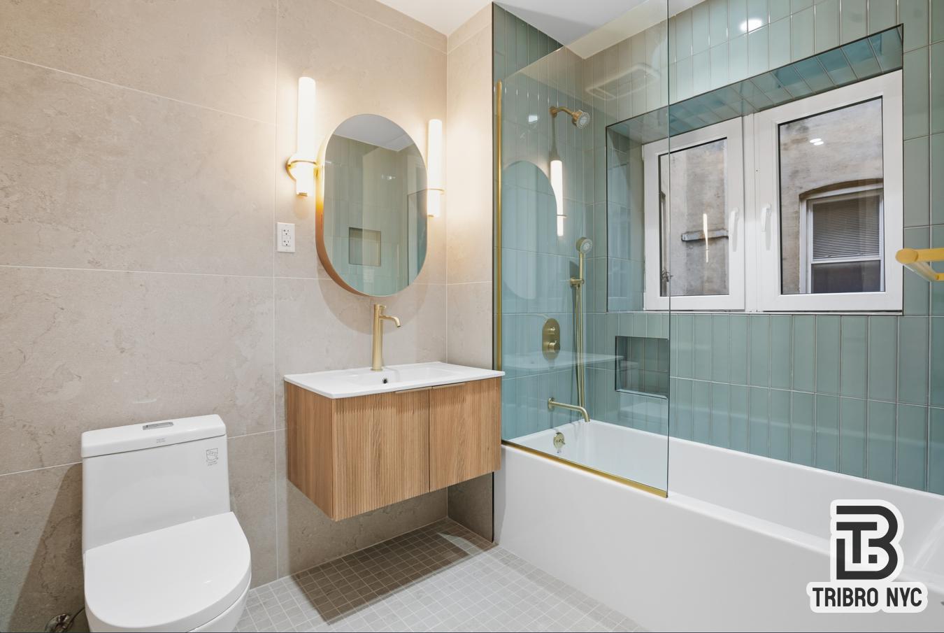 129 Russell Street, Unit 1E Brooklyn, NY 11222 - Photo 5 of 8 a bathroom with a toilet a sink and bathtub