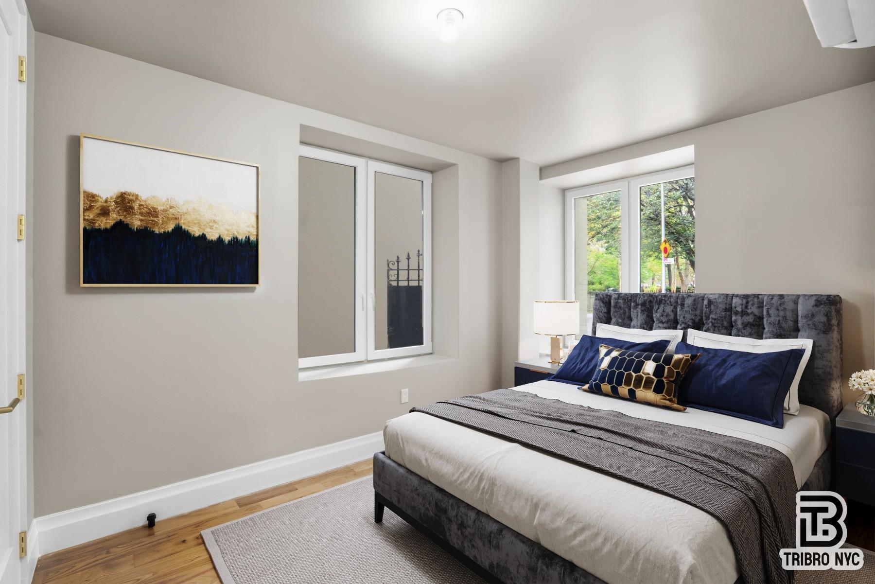 129 Russell Street, Unit 1E Brooklyn, NY 11222 - Photo 6 of 8 a bedroom with bed and a window