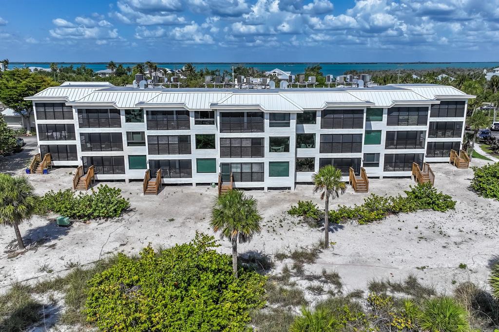 5000 Gasparilla Road, Unit BC306 Boca Grande, FL 33921 - Photo 16 of 35 a front view of a building with a garden