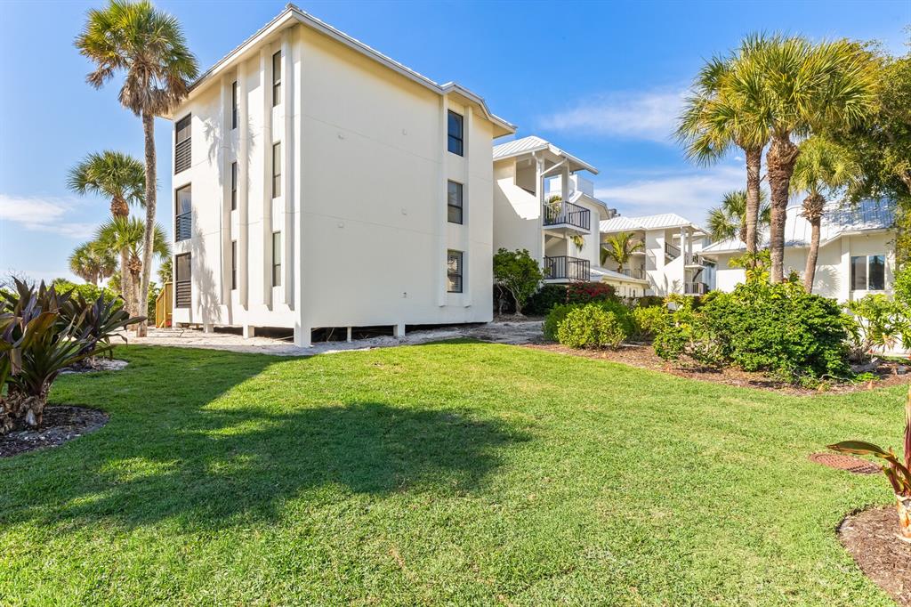 5000 Gasparilla Road, Unit BC306 Boca Grande, FL 33921 - Photo 17 of 35 a view of a back yard of the house