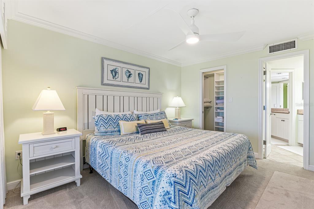 5000 Gasparilla Road, Unit BC306 Boca Grande, FL 33921 - Photo 10 of 35 a bedroom with a bed and a lamp