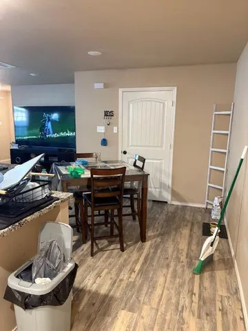 a kitchen with kitchen island granite countertop a sink stainless steel appliances and cabinets