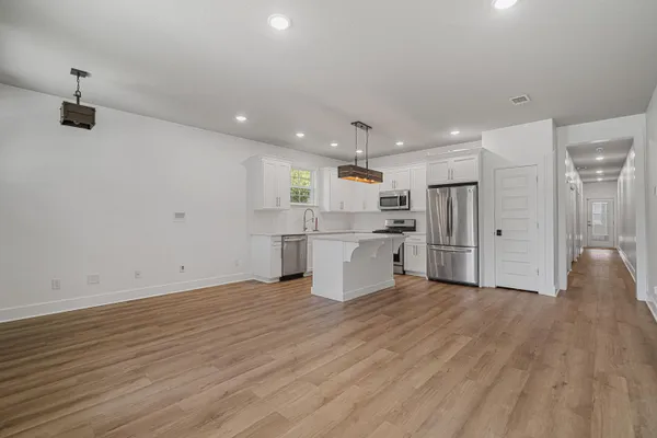 a view of kitchen with wooden floor