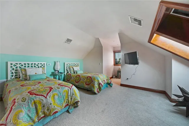 a gym room with lots of chairs and mirrors