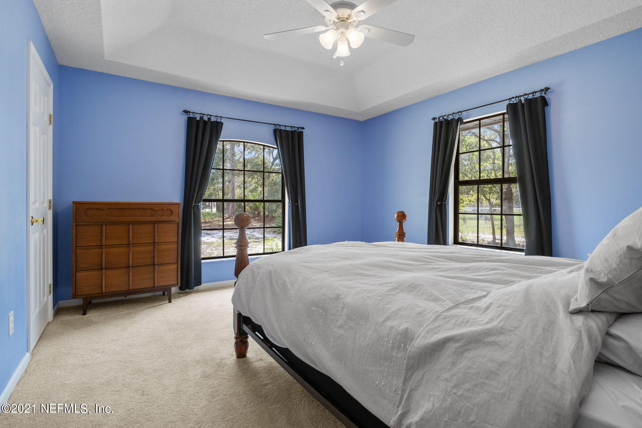 736 Halsema Road North Jacksonville, FL 32220 - Photo 13 of 29 a bed sitting in a spacious bedroom next to a window