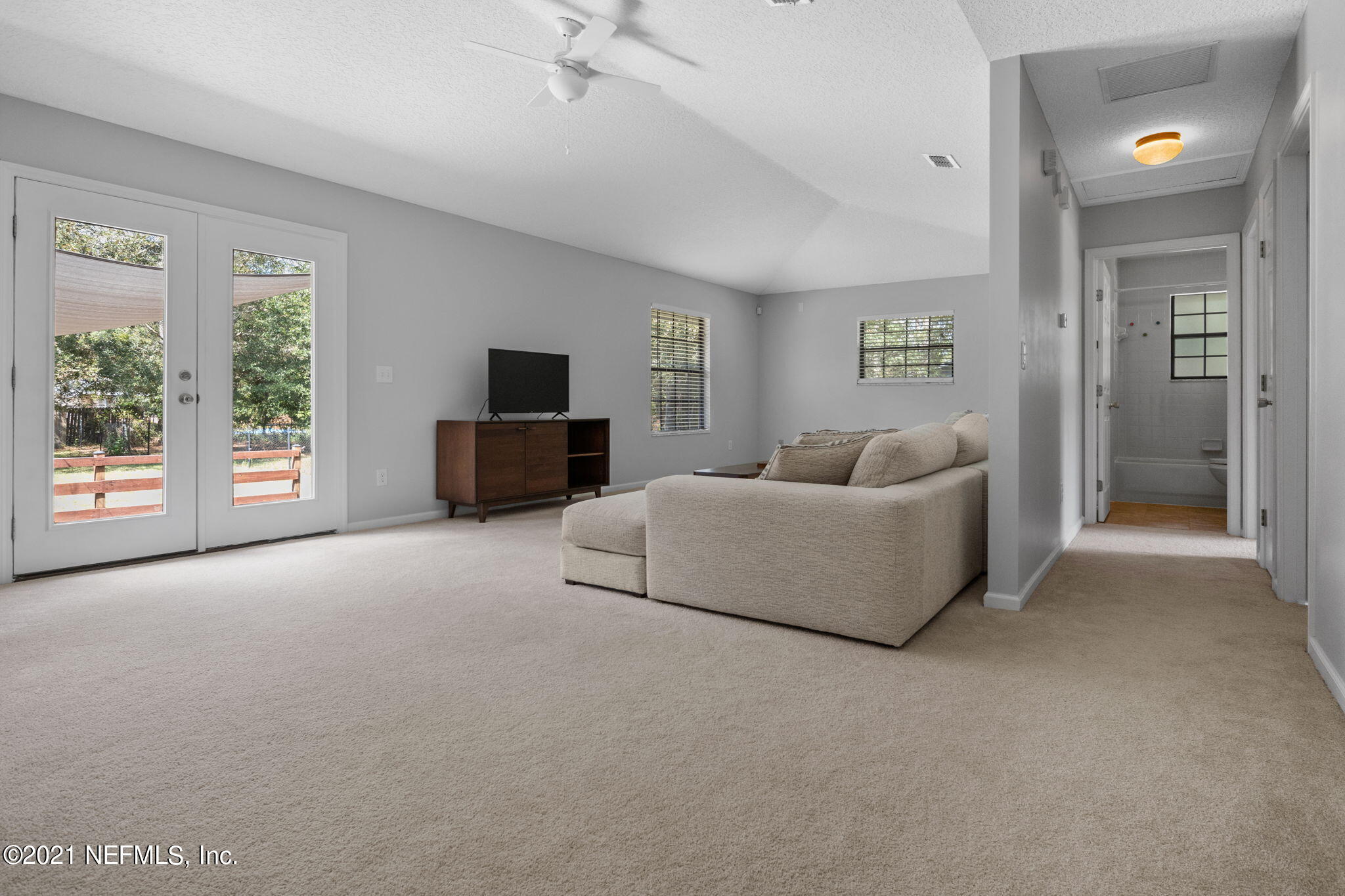 736 Halsema Road North Jacksonville, FL 32220 - Photo 15 of 29 a living room with furniture and a flat screen tv