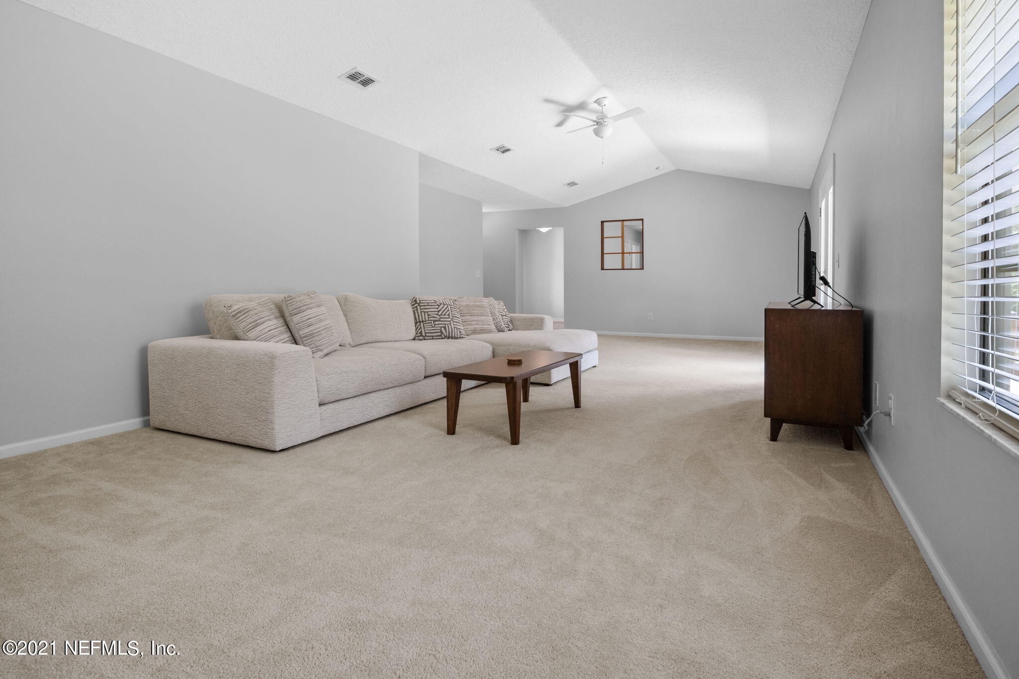 736 Halsema Road North Jacksonville, FL 32220 - Photo 16 of 29 a living room with furniture and a window