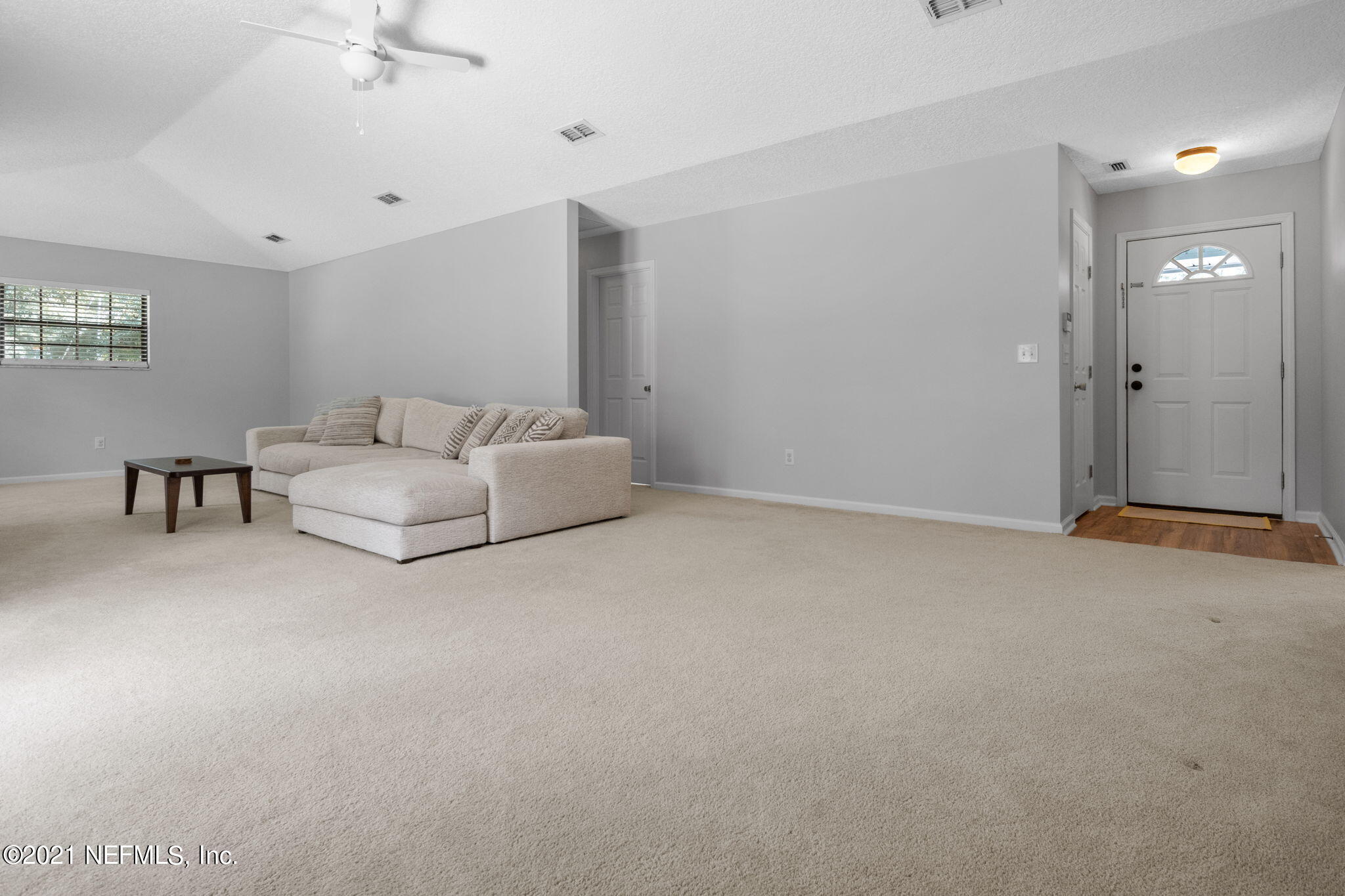 736 Halsema Road North Jacksonville, FL 32220 - Photo 17 of 29 a living room with furniture and white walls