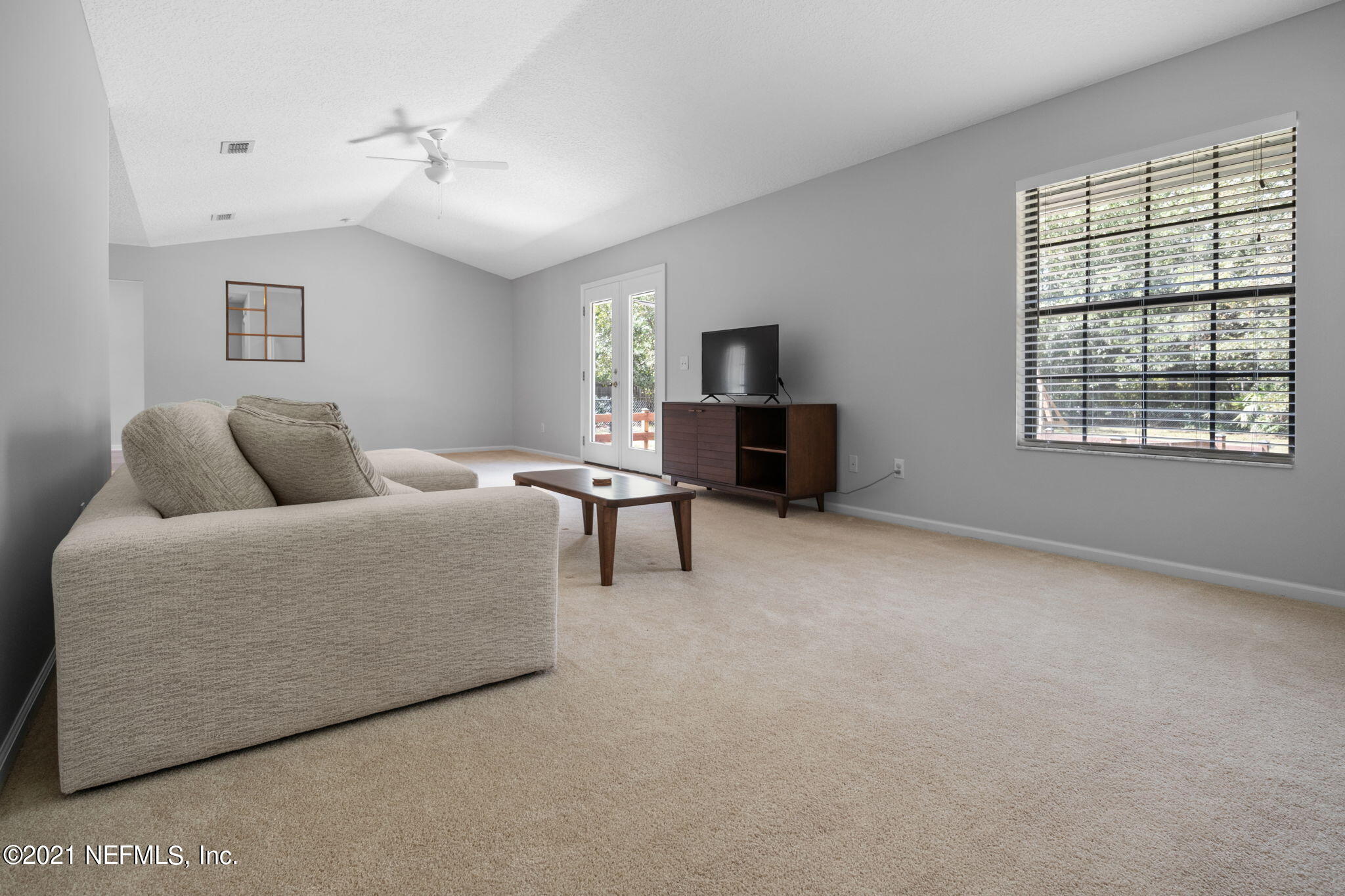 736 Halsema Road North Jacksonville, FL 32220 - Photo 18 of 29 a bedroom with furniture and a flat screen tv