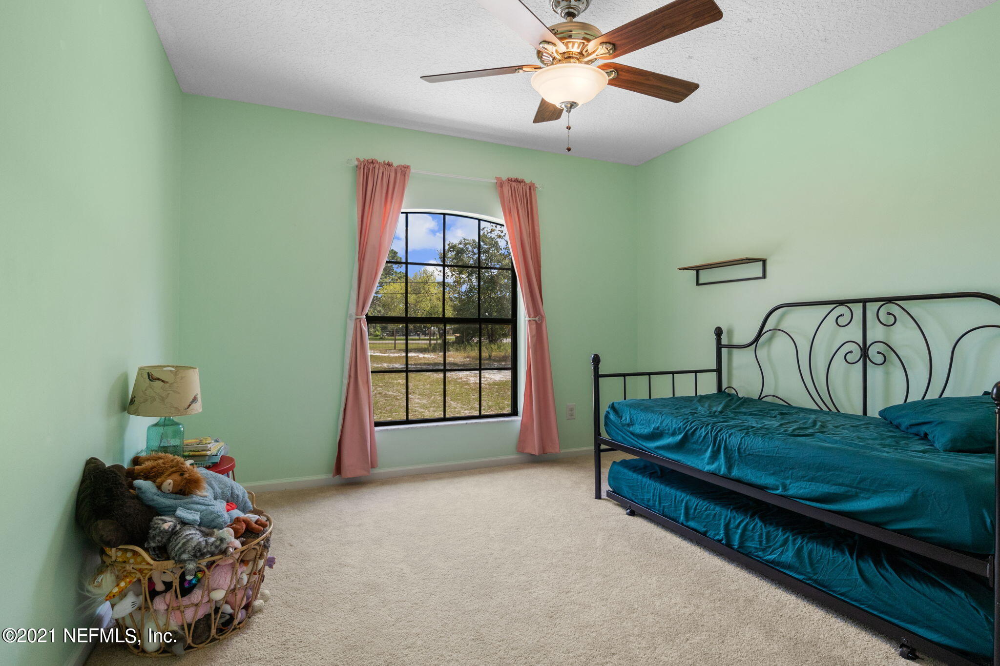 736 Halsema Road North Jacksonville, FL 32220 - Photo 20 of 29 a bedroom with furniture and a window