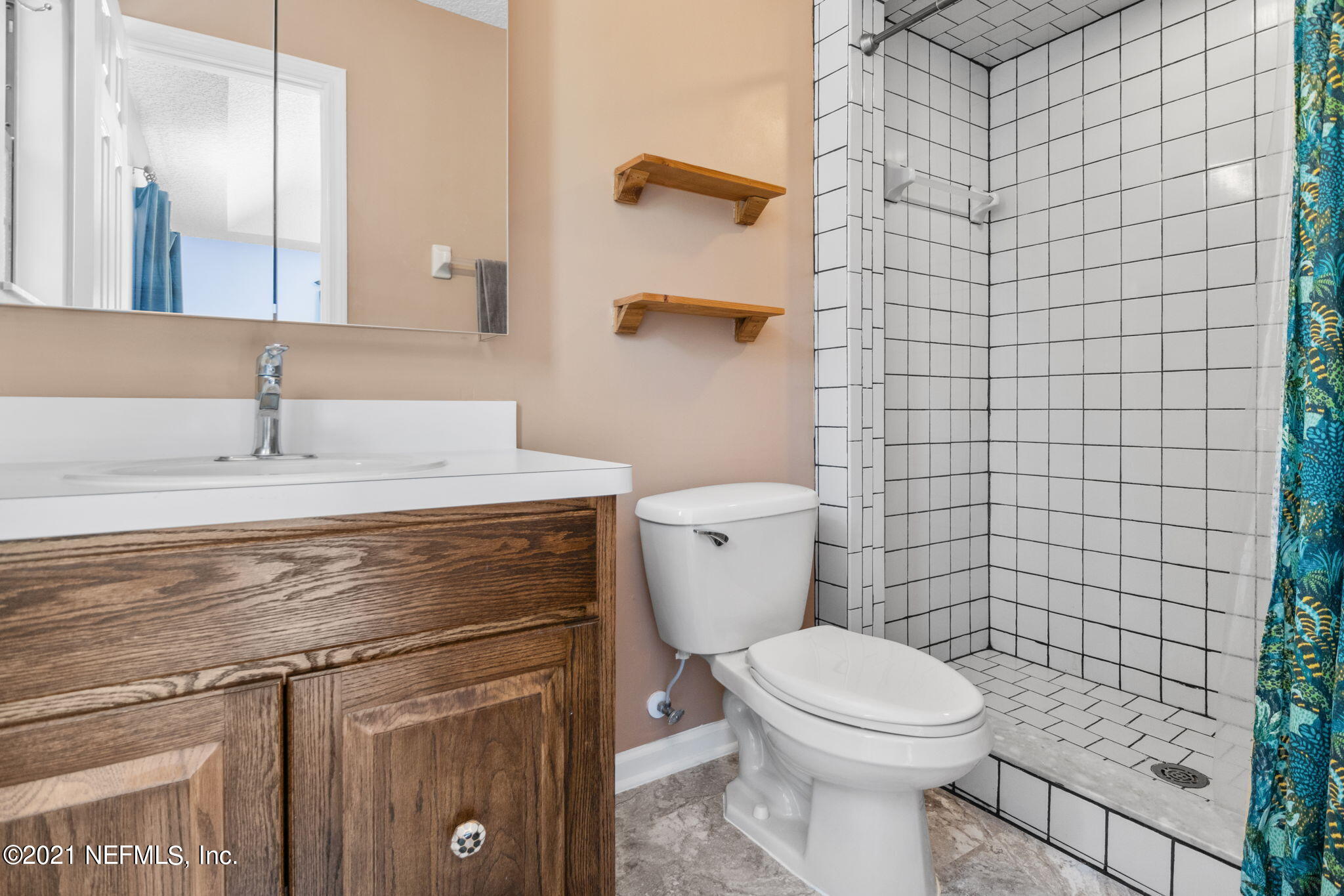 736 Halsema Road North Jacksonville, FL 32220 - Photo 23 of 29 a bathroom with a granite countertop toilet sink and mirror