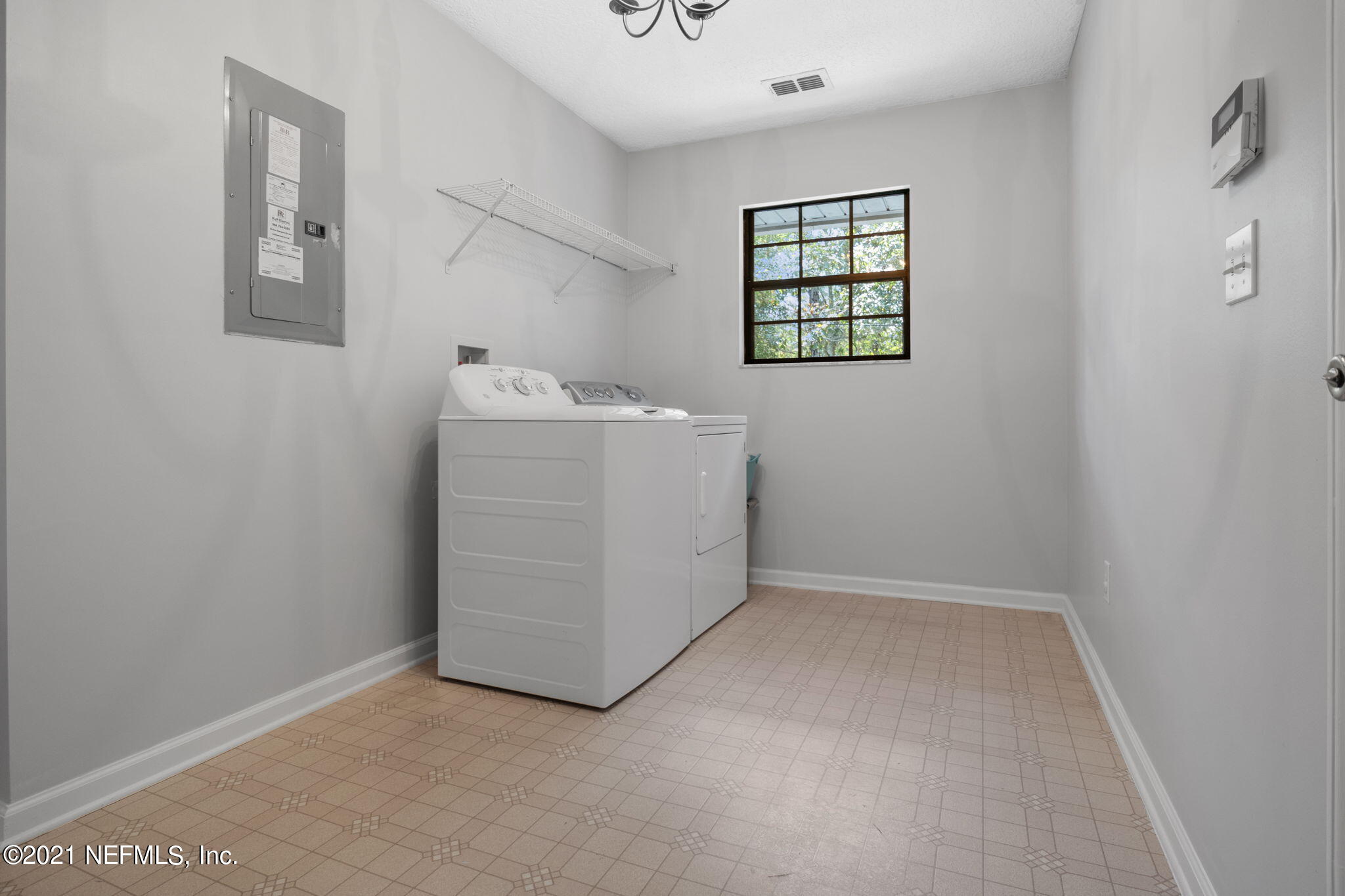 736 Halsema Road North Jacksonville, FL 32220 - Photo 25 of 29 an empty room with windows