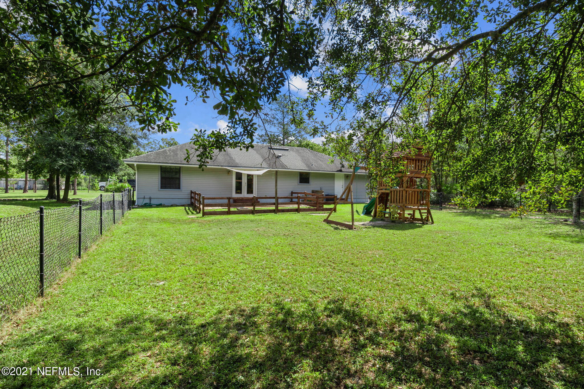 736 Halsema Road North Jacksonville, FL 32220 - Photo 28 of 29 a view of a house with a backyard porch and sitting area
