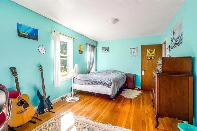 a bedroom with furniture and a window