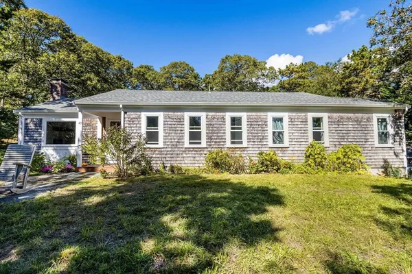 a front view of a house with a yard
