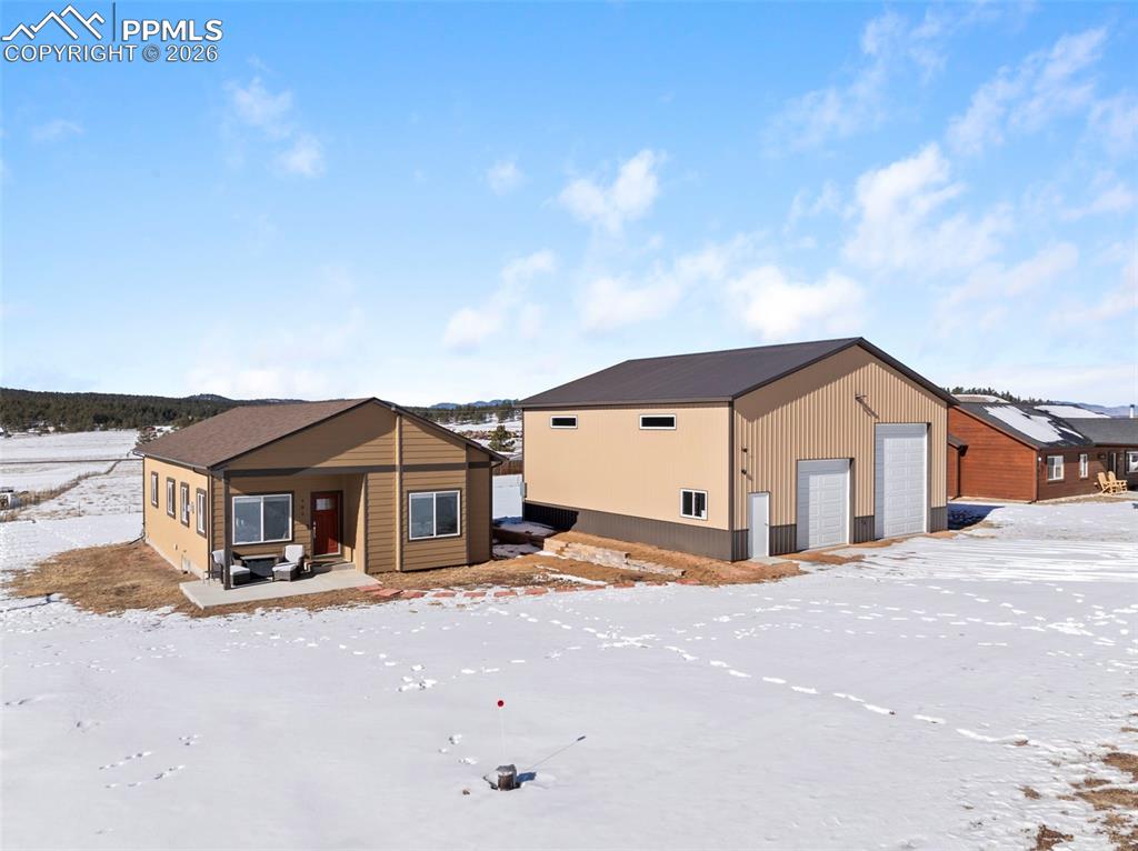 a front view of a house with a road