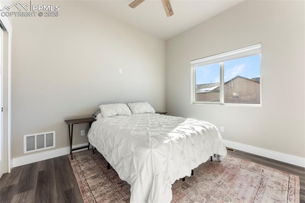 489 Due S Road Florissant, CO 80816 - Photo 19 of 41 a bed sitting in a bedroom next to a window