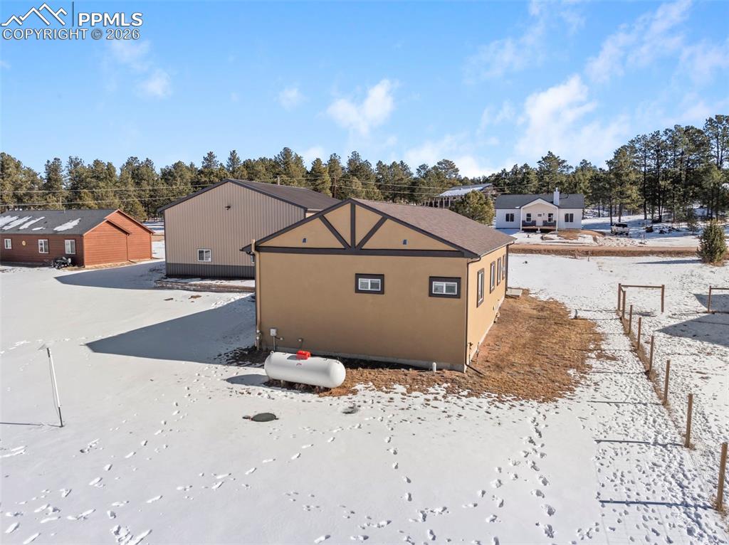 489 Due S Road Florissant, CO 80816 - Photo 32 of 41 a view of a house with a snow in the background