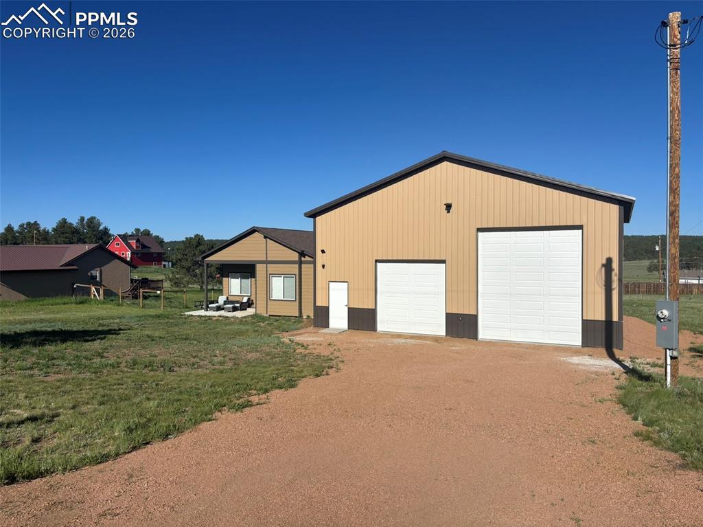 489 Due S Road Florissant, CO 80816 - Photo 38 of 41 a front view of a house with a yard