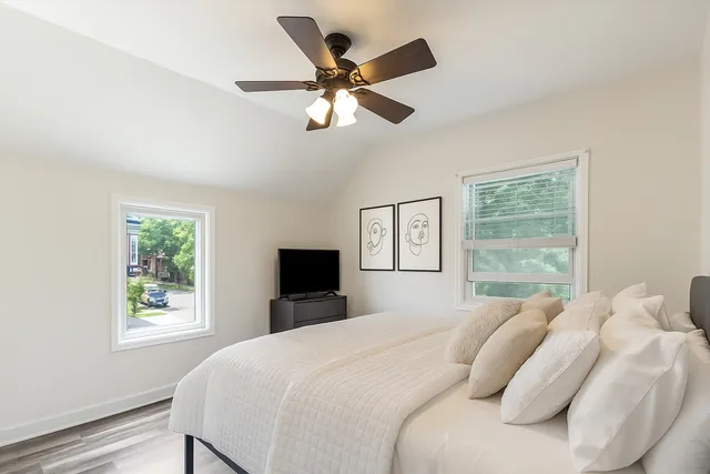 a bedroom with a bed and window