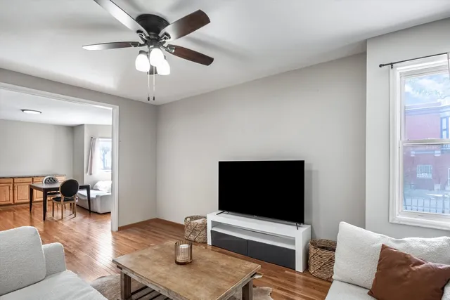 a living room with furniture and a flat screen tv