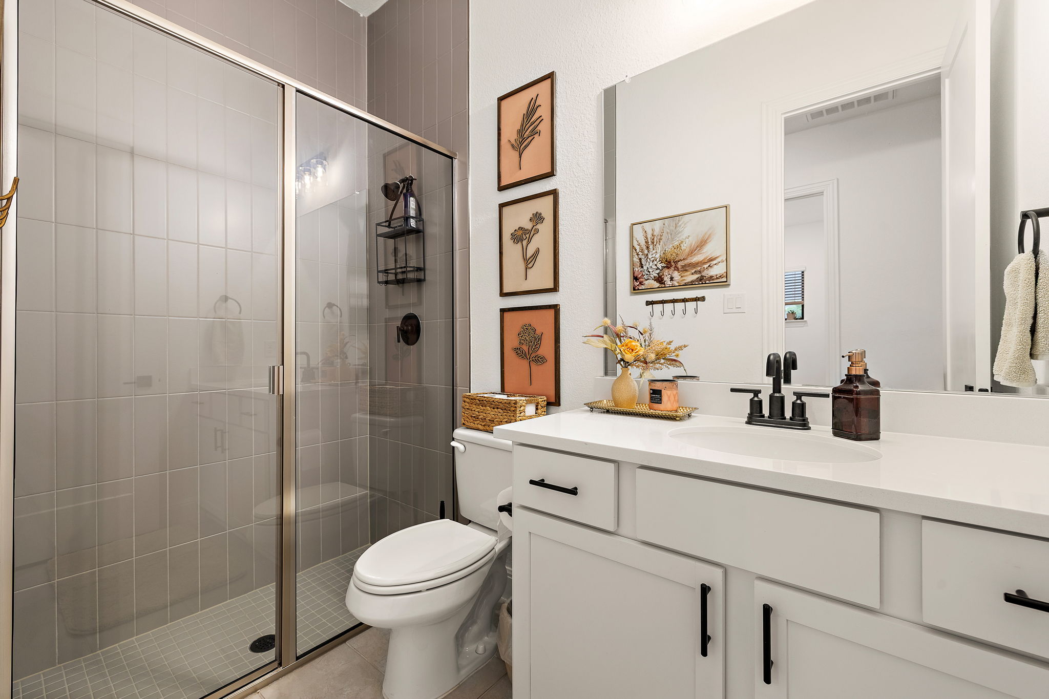 181 Constitution Way Kyle, TX 78640 - Photo 26 of 32 a bathroom with a sink toilet and shower
