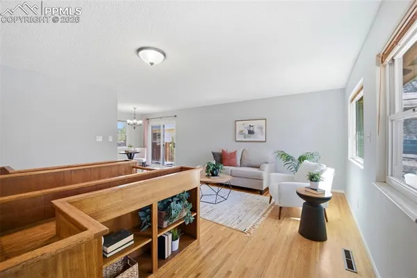 a room with furniture and wooden floor