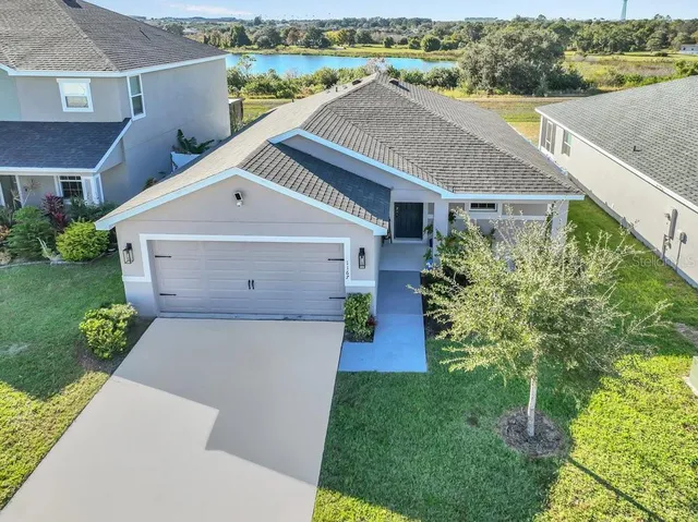 a view of a swimming pool with outdoor seating and yard
