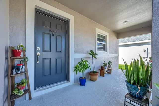 a kitchen with stainless steel appliances granite countertop a sink refrigerator and cabinets