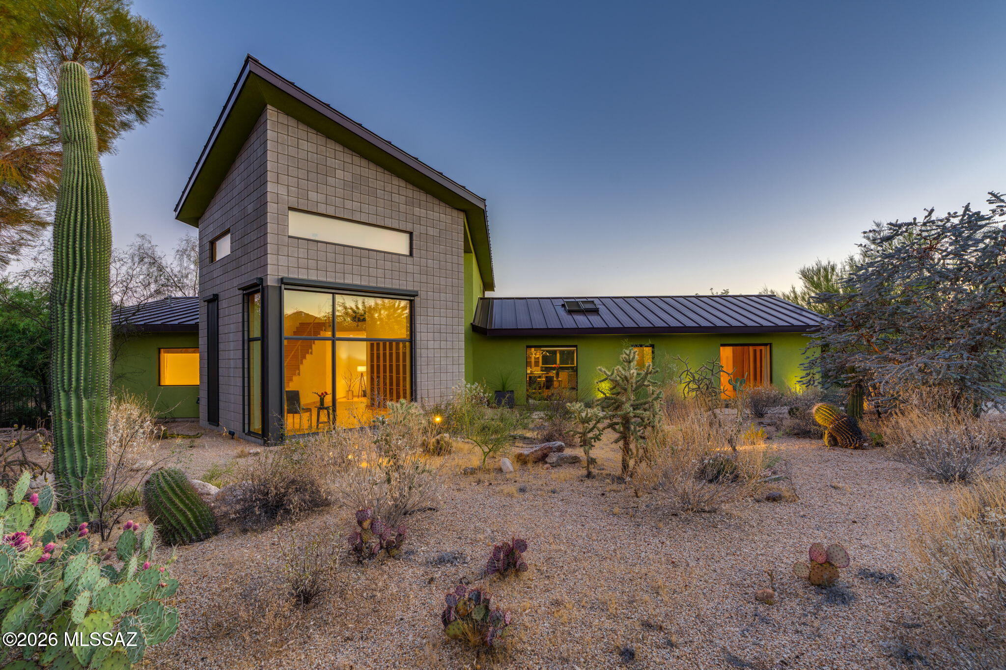 5070 North Valley View Road Tucson, AZ 85718 - Photo 7 of 51 a front view of a house with garden